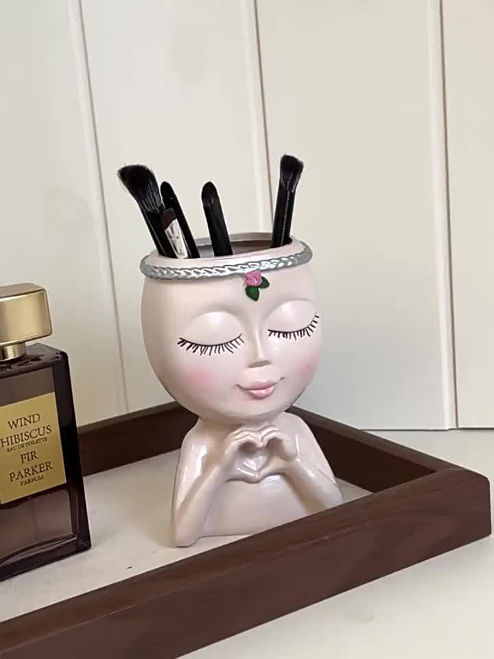 Organizador de brochas de maquillaje con forma de rostro