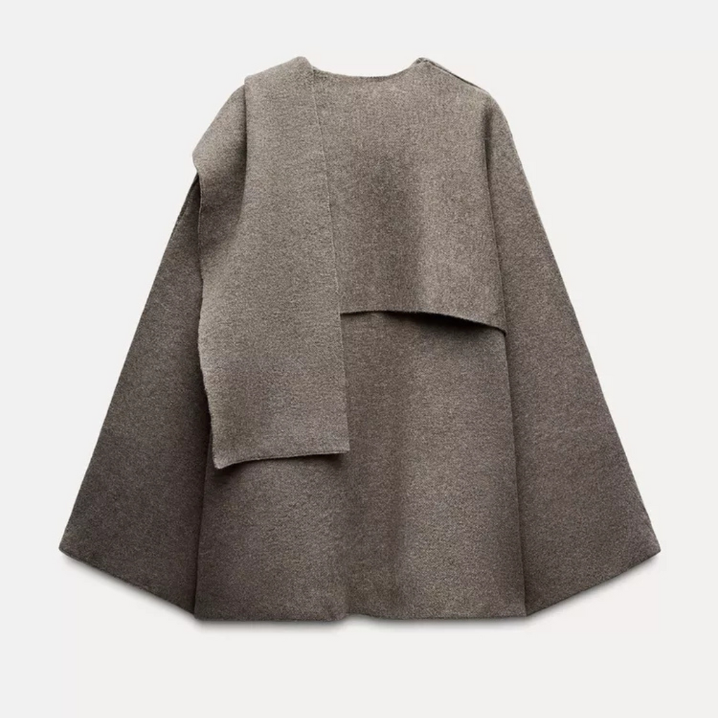 Damponcho med draperad halsringning
