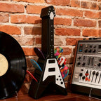 Soporte para púas con forma de guitarra