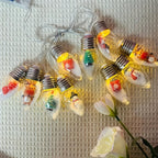 Weihnachtslichterkette mit Miniaturfiguren
