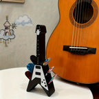 Soporte para púas con forma de guitarra