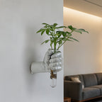 Jarrón de pared con forma de mano para flores