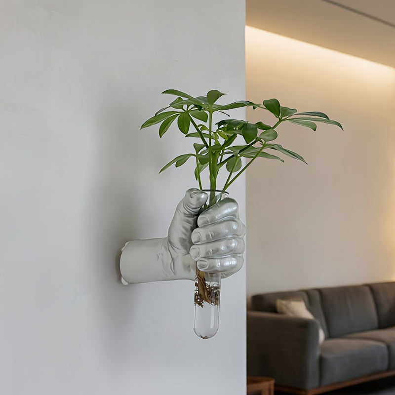 Jarrón de pared con forma de mano para flores
