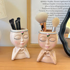 Organizador de brochas de maquillaje con forma de rostro