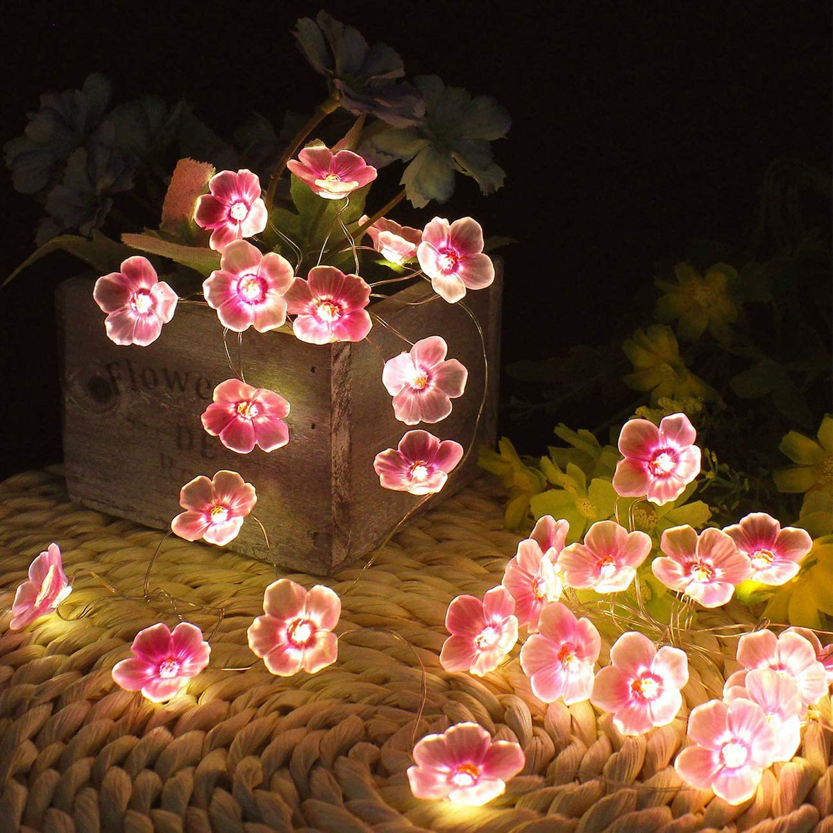 Dekorativ LED-lyskæde med lyserøde blomster