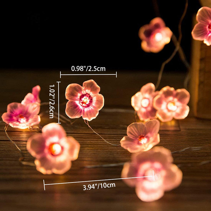 Dekorativ LED-lyskæde med lyserøde blomster