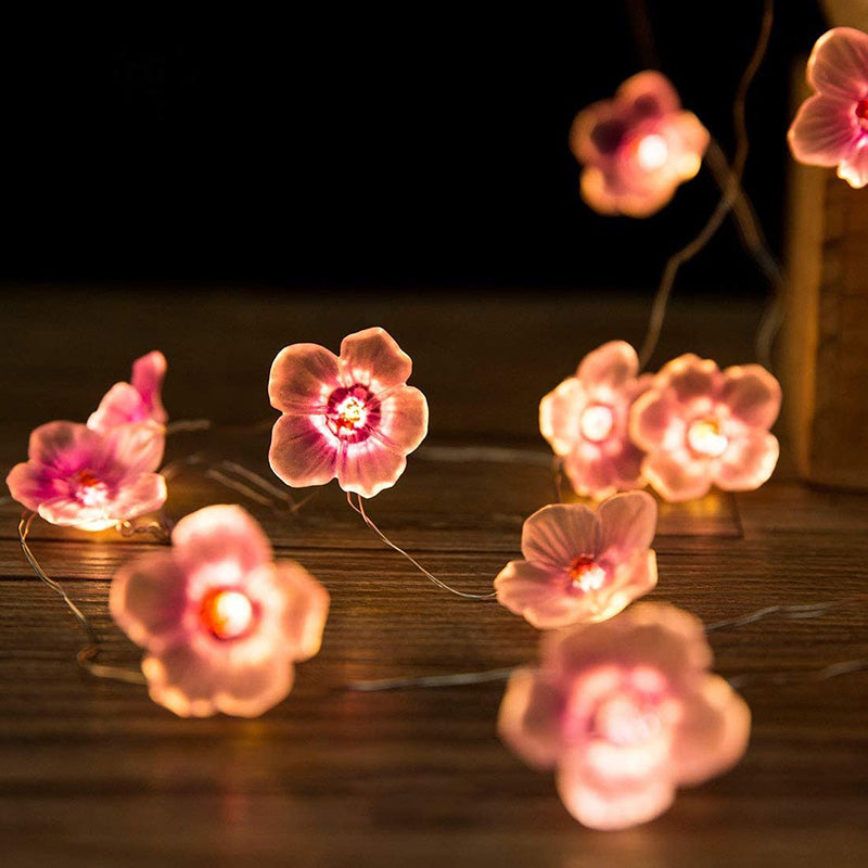 Dekorativ LED-lyskæde med lyserøde blomster