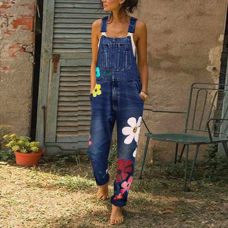 Dame denim-overalls med blomsterbroderi og justerbare skulderstropper  