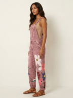 Dame denim-overalls med blomsterbroderi og justerbare skulderstropper  