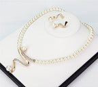 Set di collana e orecchini da donna con perle e cristalli a spirale