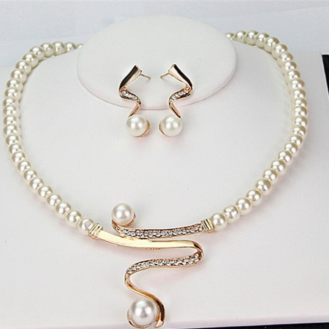 Set di collana e orecchini da donna con perle e cristalli a spirale
