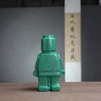 Dekorativ keramisk vase formet som en robot
