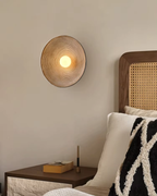 Applique murale en résine texturée au design concentrique avec douce lueur d’ambiance