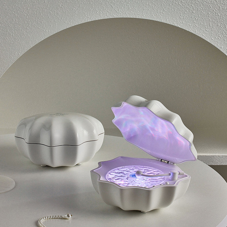 LED-natlampe formet som en muslingeskal med Bluetooth-højttaler