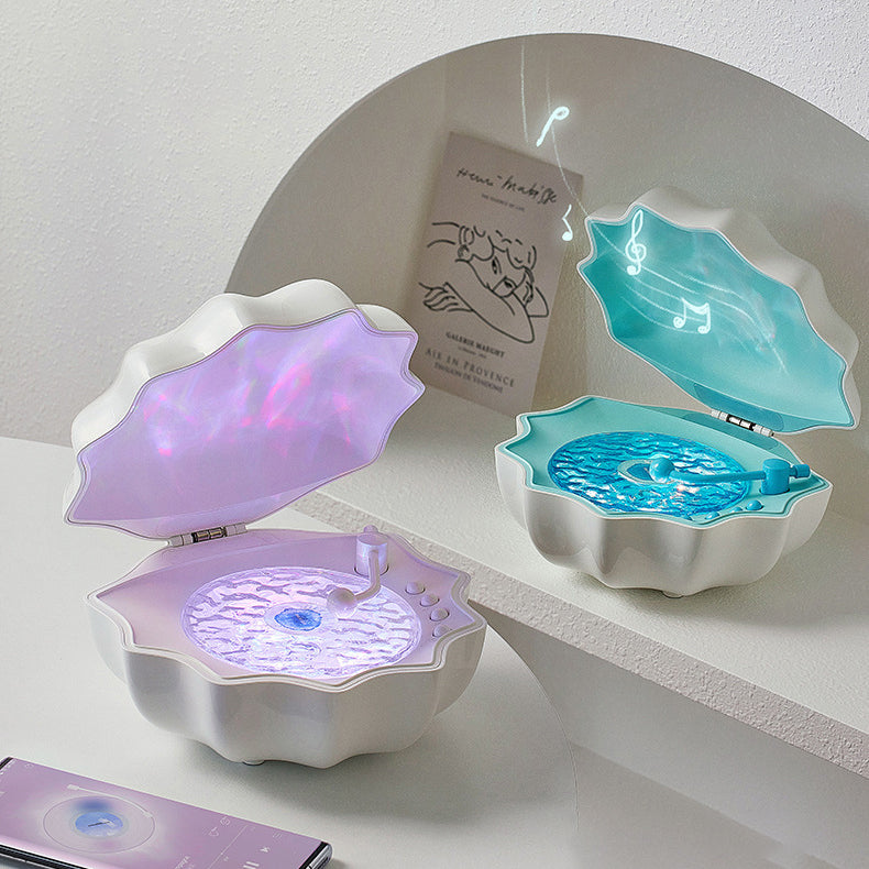 LED-natlampe formet som en muslingeskal med Bluetooth-højttaler