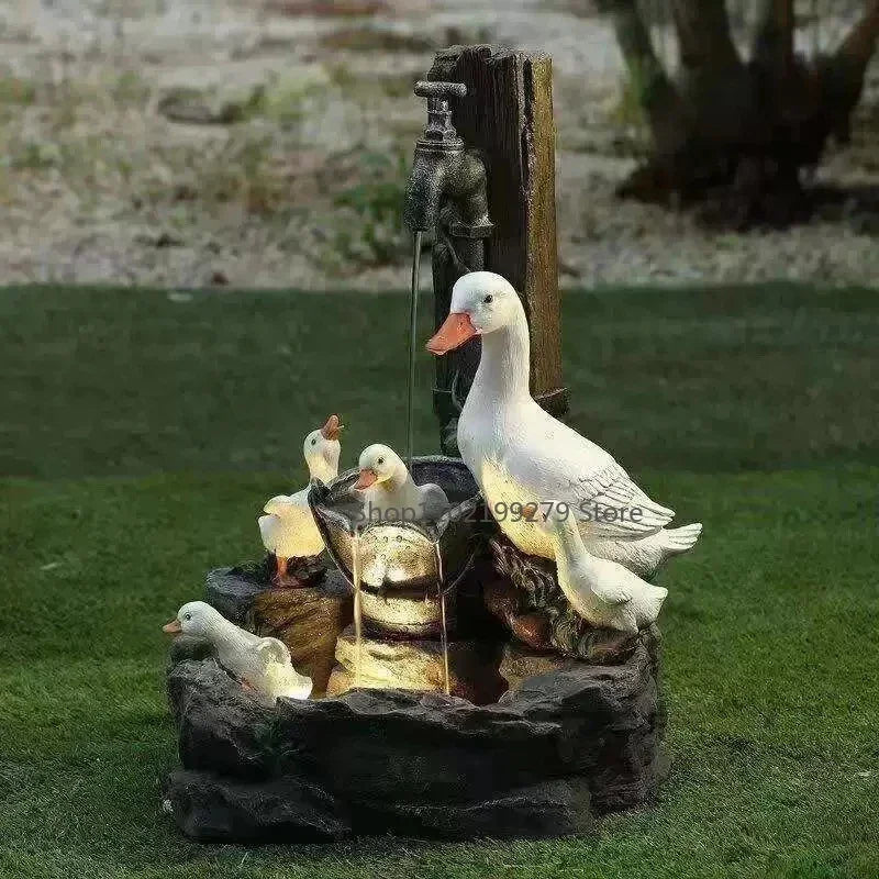 Fontana decorativa da esterno con famiglia di anatre