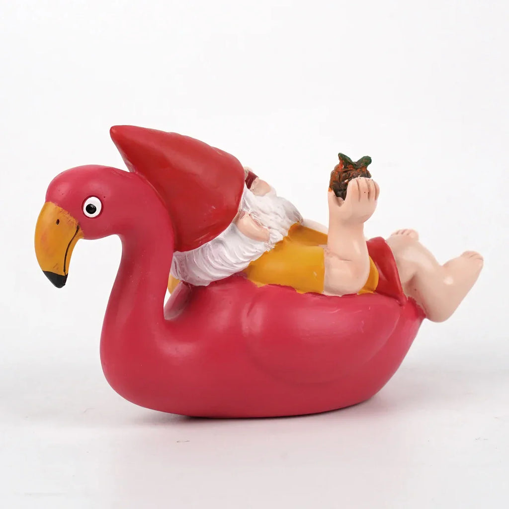 Tropisk havefigur af en flamingo med nissehue