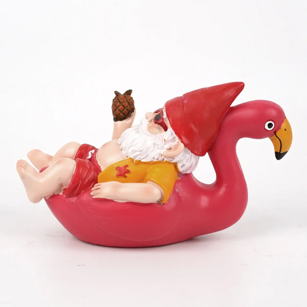 Tropisk havefigur af en flamingo med nissehue