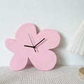 Horloge murale sculpturale en forme de fleur avec affichage analogique minimaliste