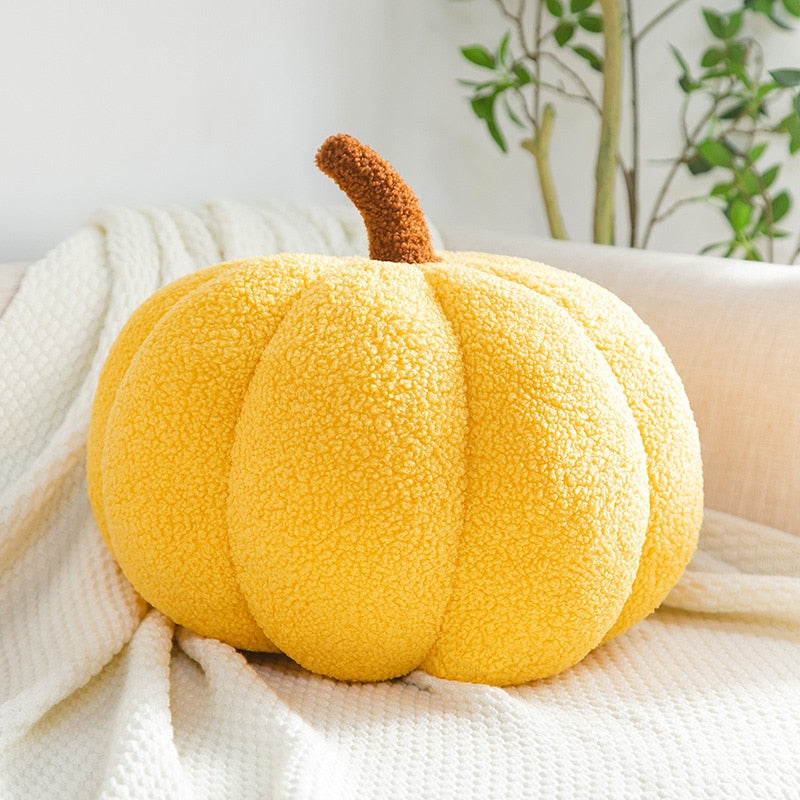 Cojín decorativo con forma de calabaza, de tela texturizada y diseño afelpado