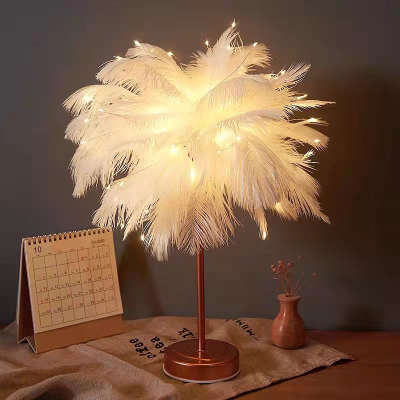Lampada da tavolo LED con piume di struzzo