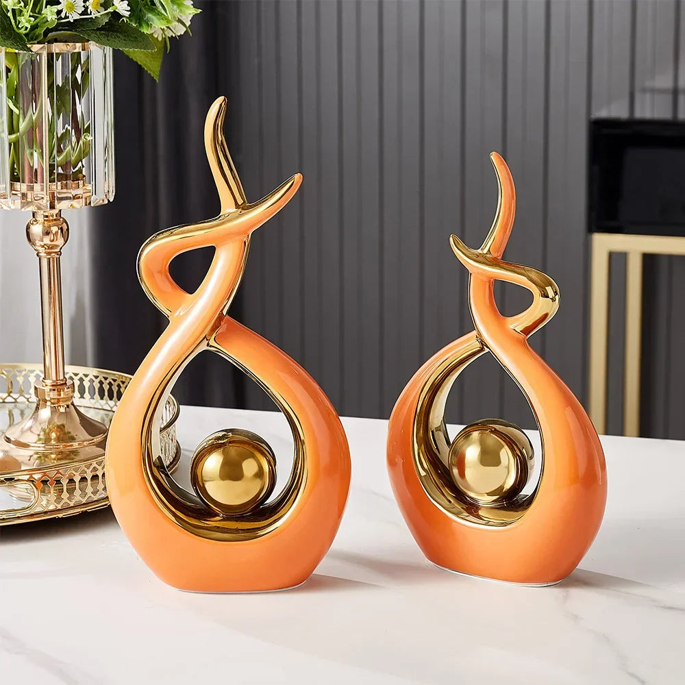 Figuras decorativas esculturales abstractas con curvas entrelazadas y detalles esféricos