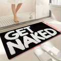 Badrumsmatta med texten "Get Naked"