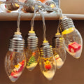 Weihnachtslichterkette mit Miniaturfiguren