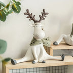 Decorazione natalizia con renna seduta