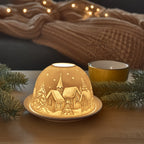 Portavelas luminoso de pueblo navideño