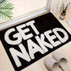 Badrumsmatta med texten "Get Naked"