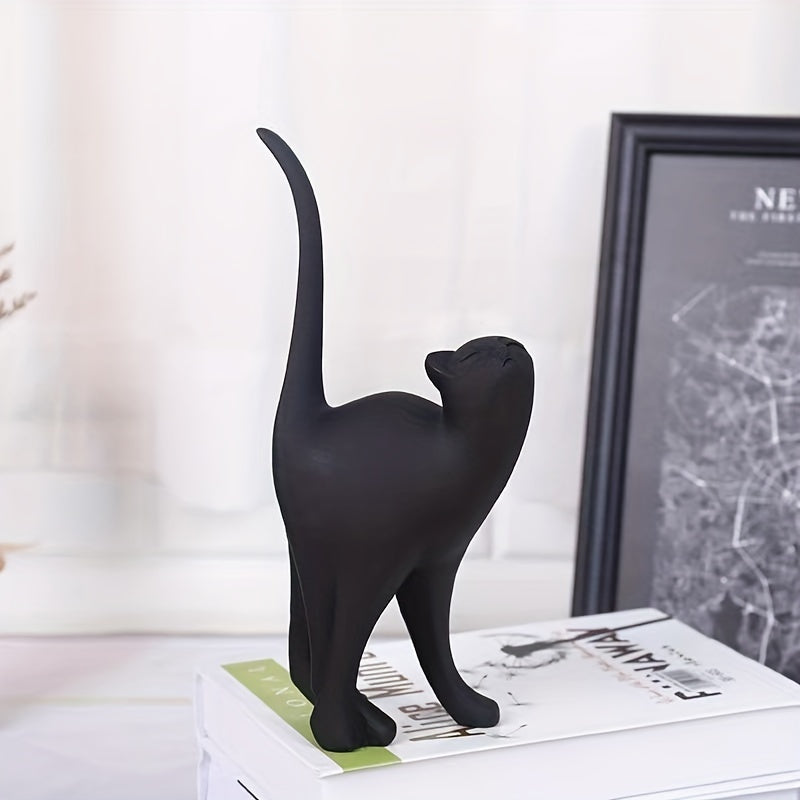 Figura decorativa minimalista de gato negro con la cola levantada