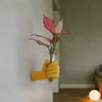 Jarrón de pared con forma de mano para flores