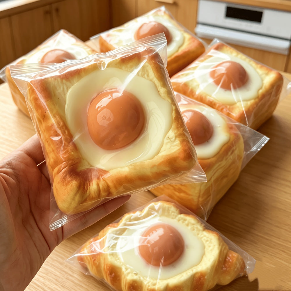 Stressleksak som kläms ihop, rostat bröd med stekt ägg