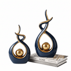 Elegante scultura astratta a forma di infinito, con curve fluide intrecciate e dettagli sferici