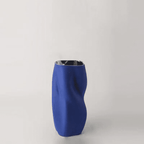 Textured Ceramic Vase with Curved Silhouette and Contemporary Sculpted Form