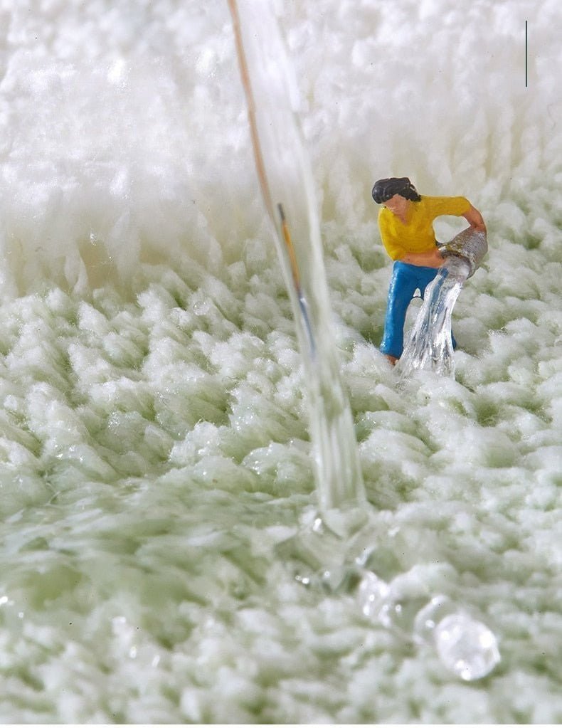 Alfombrilla de baño de felpa con motivo floral y borde en contraste