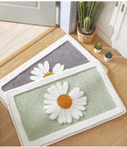 Alfombrilla de baño de felpa con motivo floral y borde en contraste