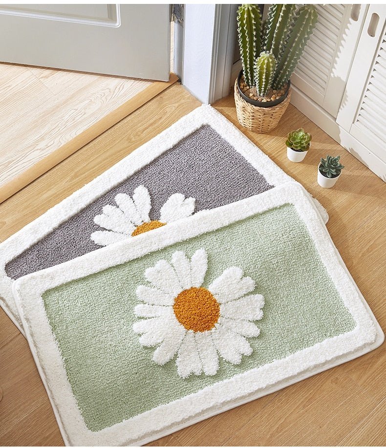 Alfombrilla de baño de felpa con motivo floral y borde en contraste
