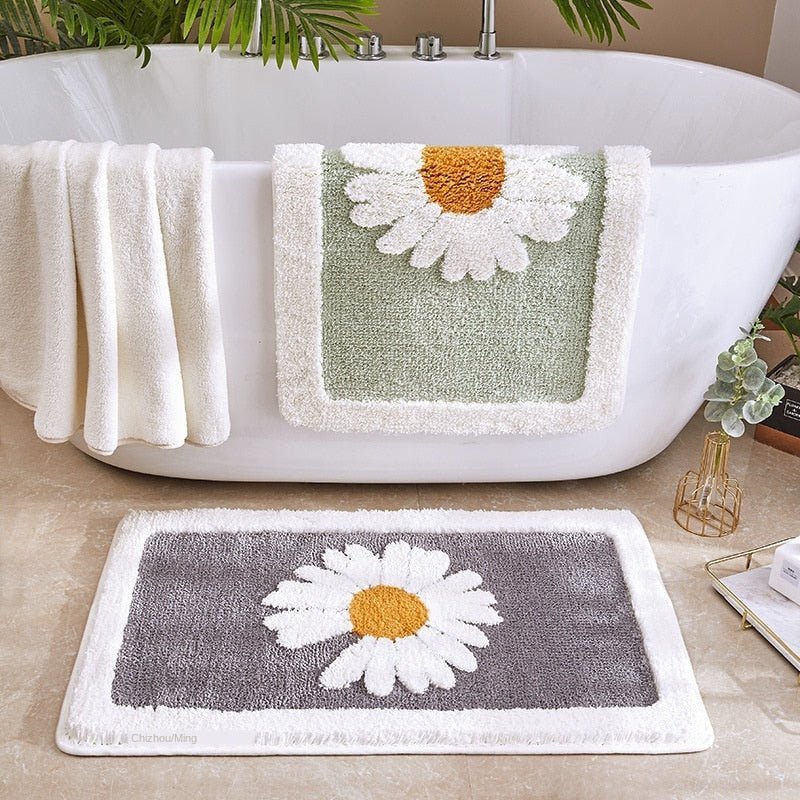 Alfombrilla de baño de felpa con motivo floral y borde en contraste