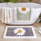Alfombrilla de baño de felpa con motivo floral y borde en contraste