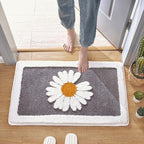 Alfombrilla de baño de felpa con motivo floral y borde en contraste