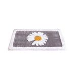 Alfombrilla de baño de felpa con motivo floral y borde en contraste