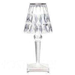 Lampada da tavolo in cristallo ambrato con paralume sfaccettato ed elegante silhouette decorativa