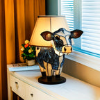 Dekorativ bordslampa formad som en ko