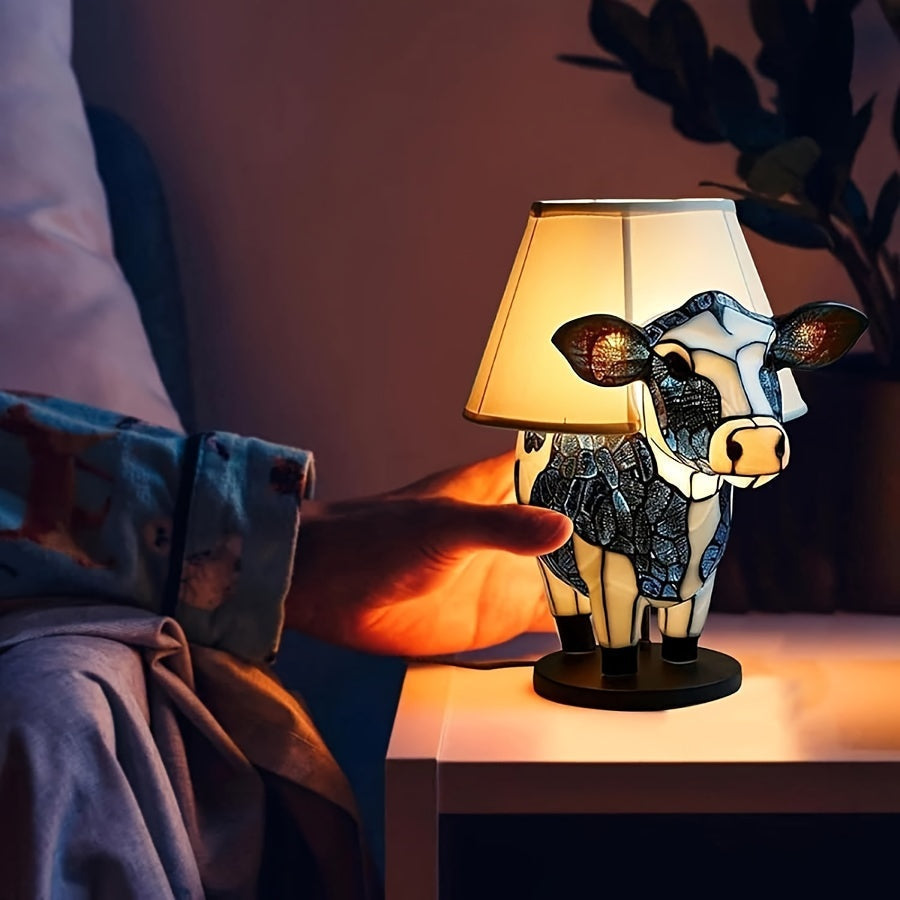 Dekorativ bordslampa formad som en ko
