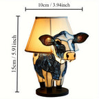 Dekorativ bordslampa formad som en ko