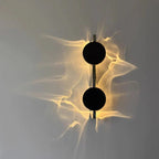 Lampada da parete scultorea rotante con effetto ondulato