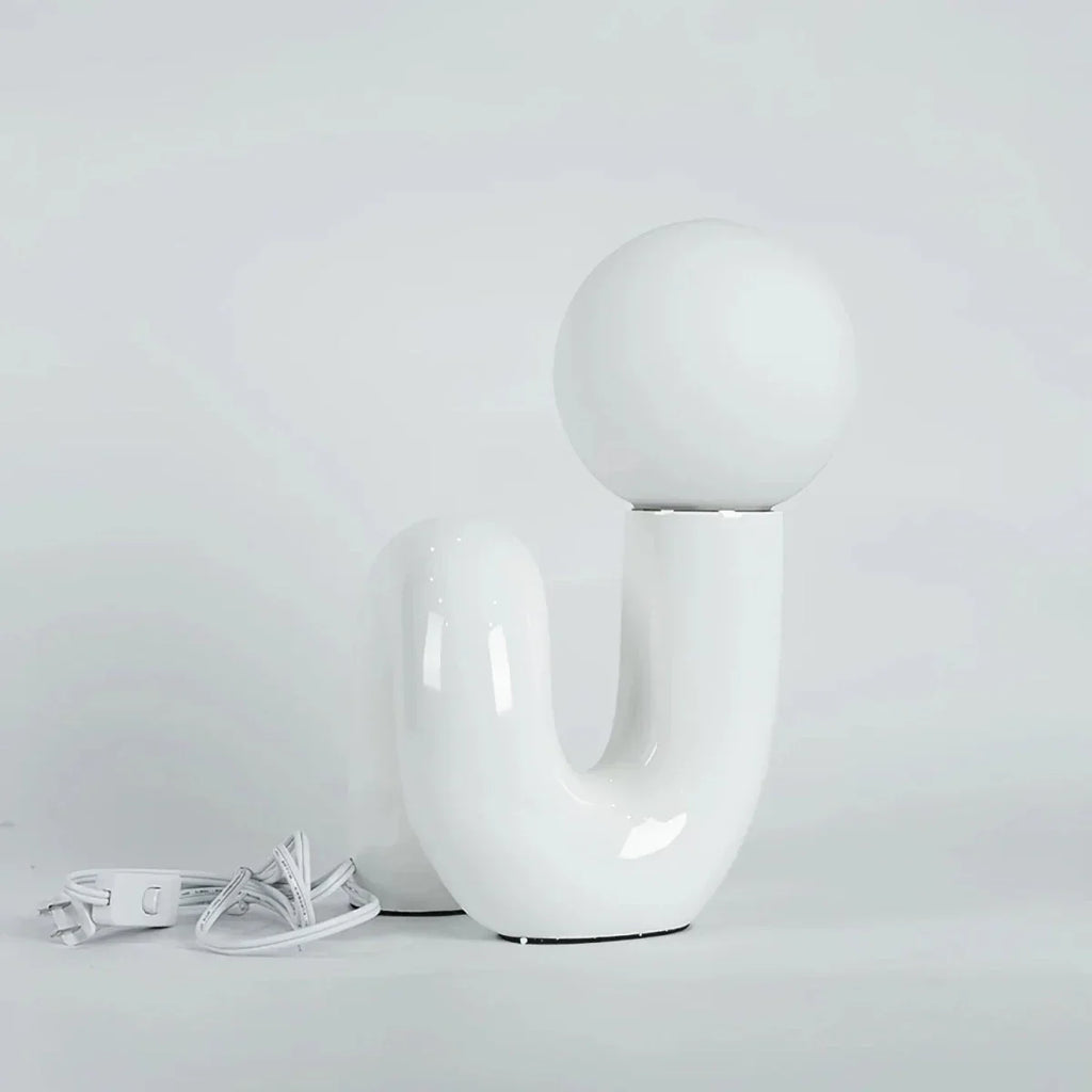 Skulptural böjd bordslampa i harts med glaskupa