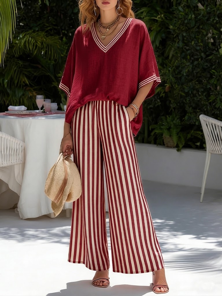 Conjunto para mujer de blusa oversize con cuello en V y pantalón ancho a rayas